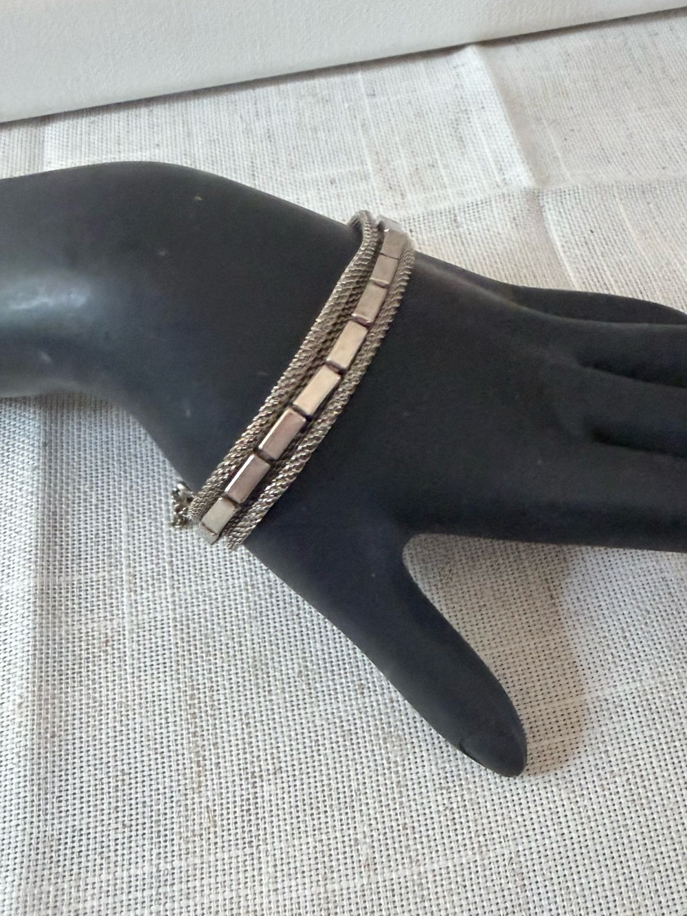 The image shows a vintage multi-strand silver-tone metal mesh bracelet